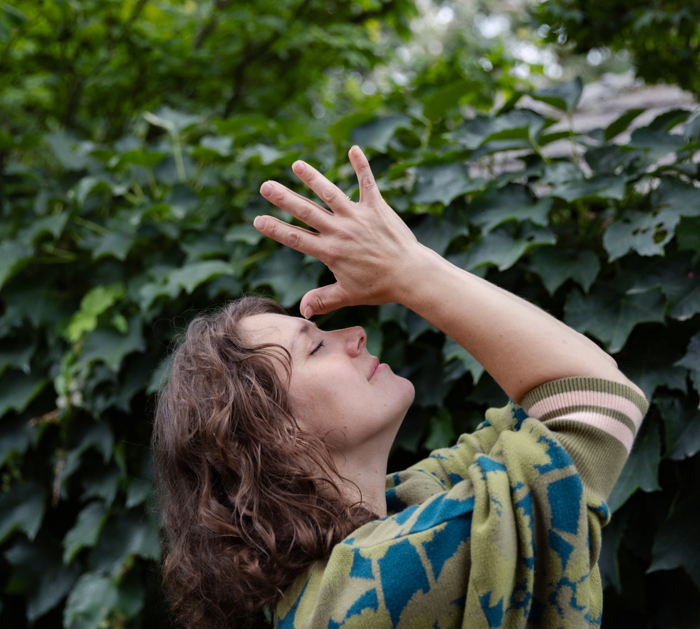 Erin in a meditative mudra pose during a gentle yoga practice in Melbourne's eastern suburbs