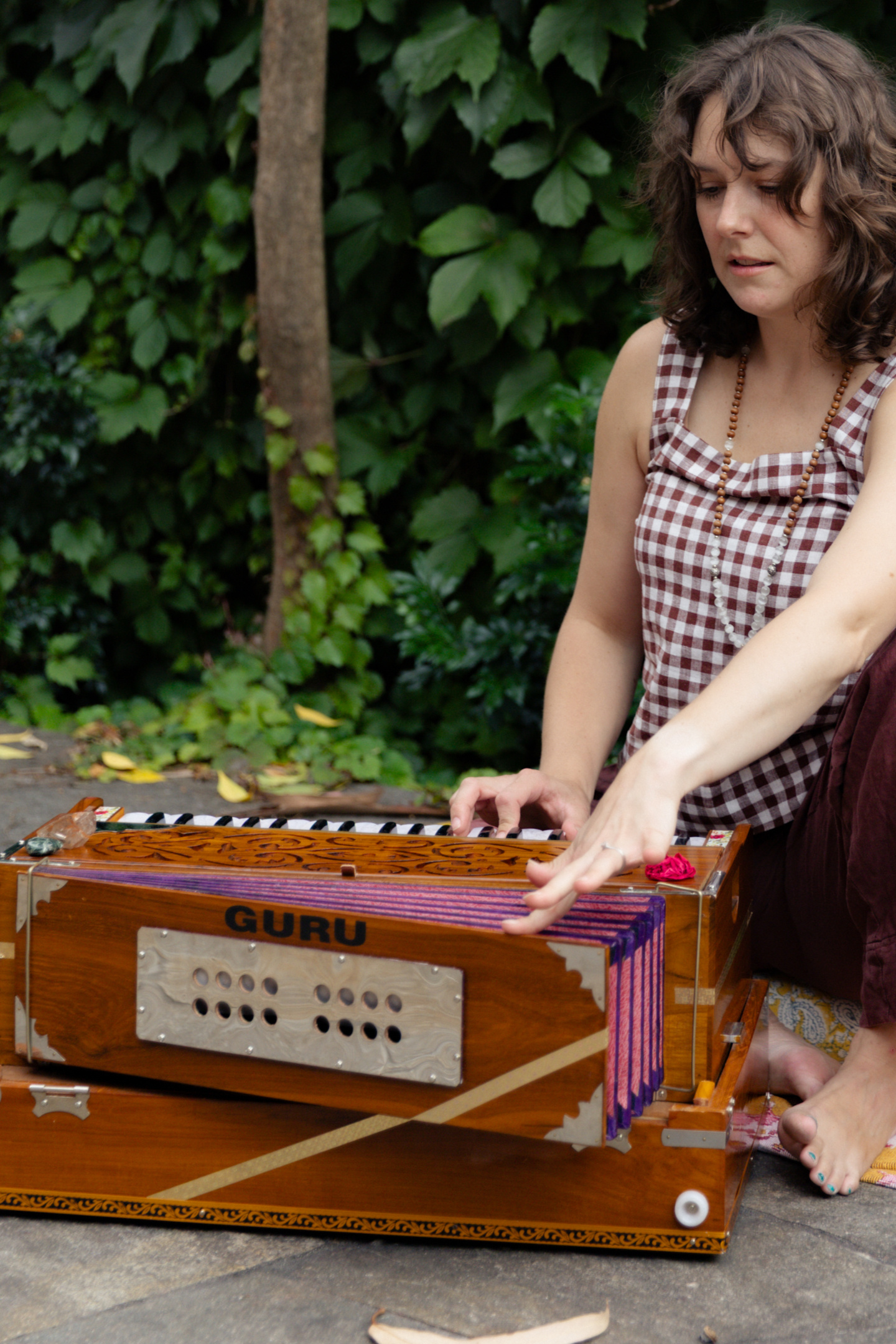 Erin playing harmonium for a sound meditation session at Beautiful Yoga